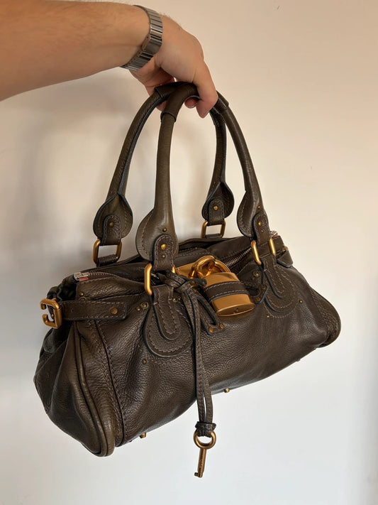 Chloé green leather Paddington bag with brass hardware and engraved padlock detail.