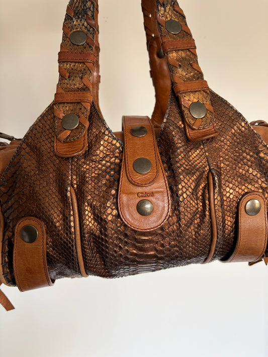 Chloé Silverado bag in metallic bronze python with whipstitched handles and studs