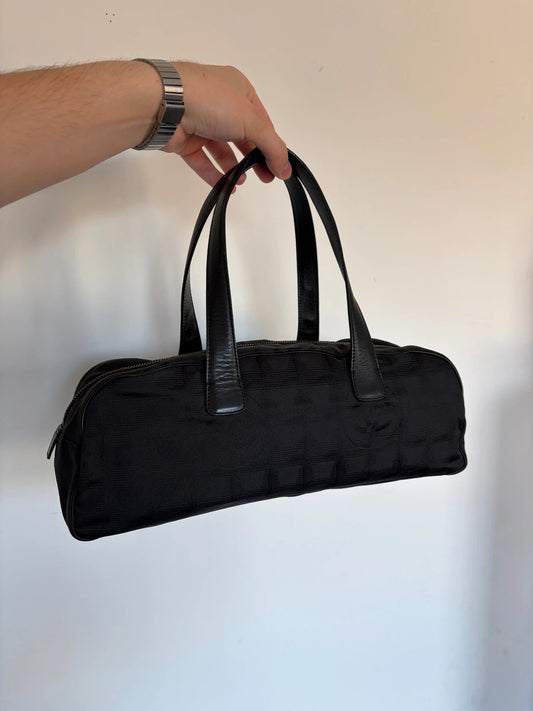Chanel black handbag woven nylon jacquard with repeating CC monogram and leather trim.