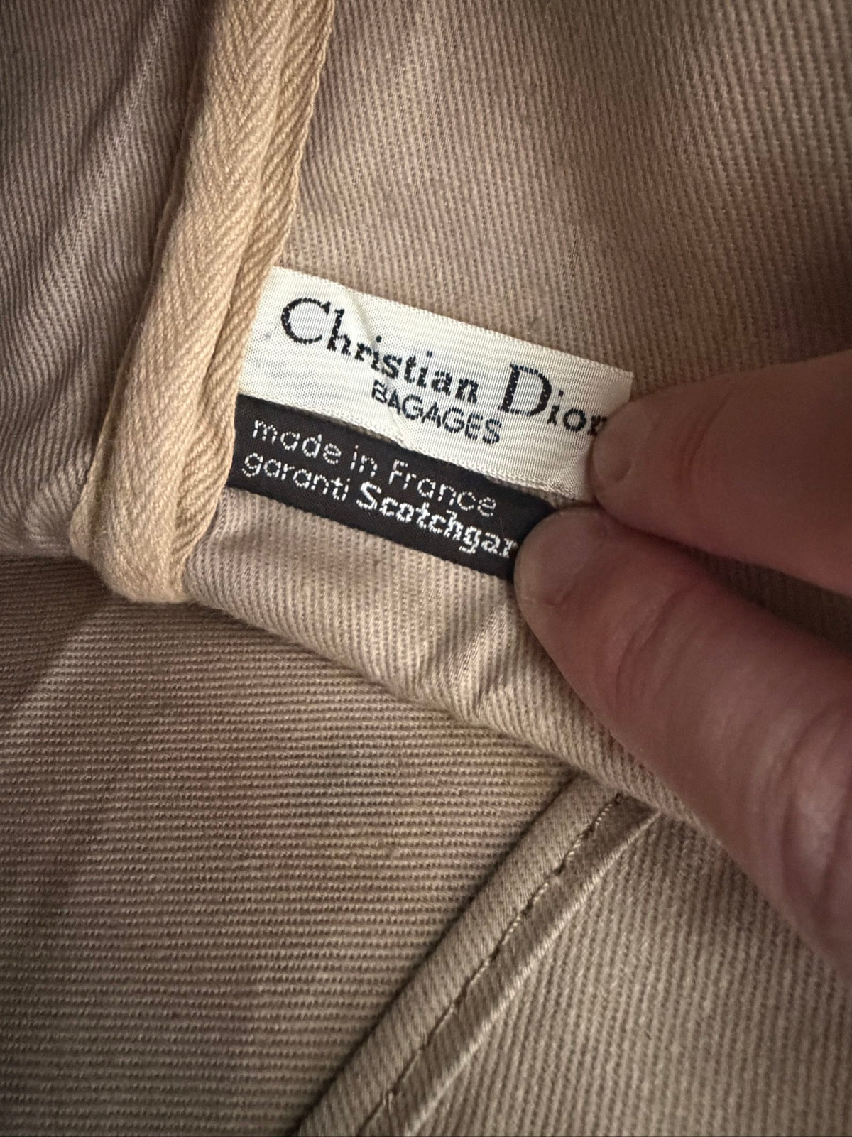 Christian Dior black duffel bag embossed jacquard fabric with leather trim and handles.
