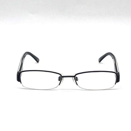 Chanel black rectangular rimless eyeglasses with white CC detailing and adjustable nose pads.