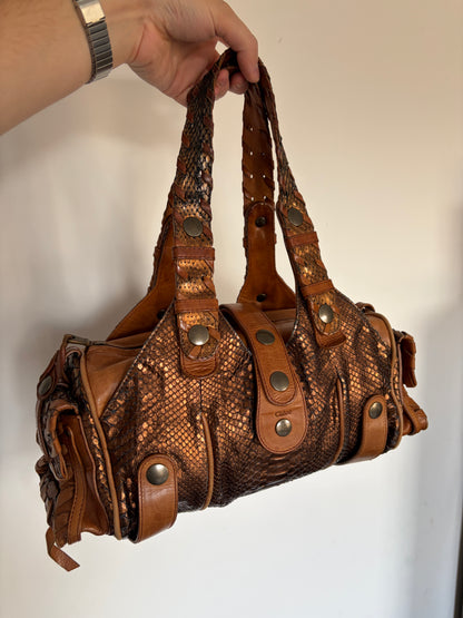 Chloé Silverado bag in metallic bronze python with whipstitched handles and studs