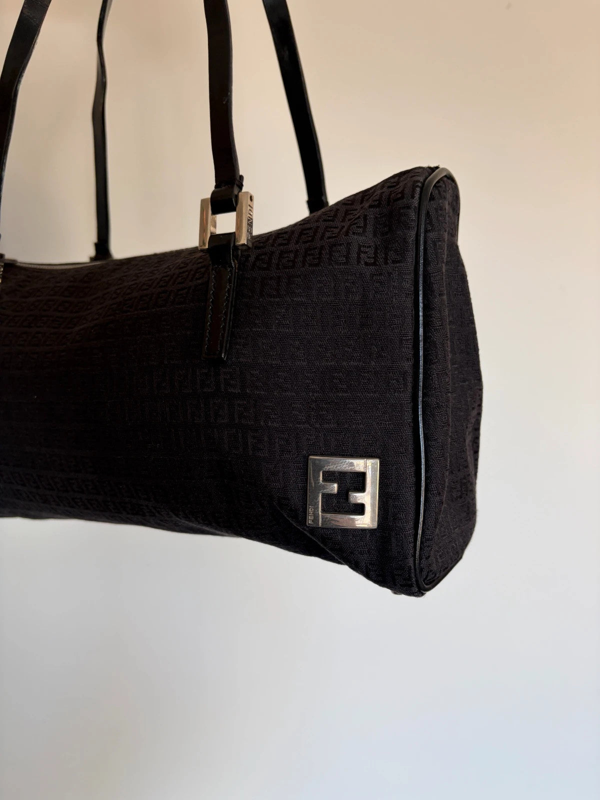 Fendi black shoulder bag with Zucchino monogram canvas, silver-tone hardware, and leather trim.