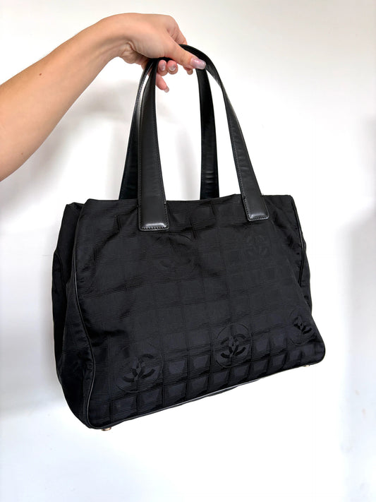 Chanel black MM tote bag jacquard nylon with interlocking CC monogram and leather handles.