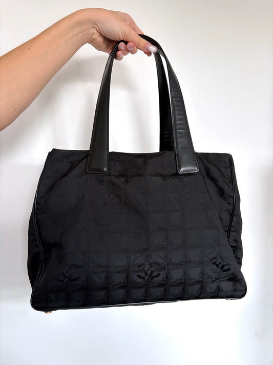 Chanel black MM tote bag jacquard nylon with interlocking CC monogram and leather handles.