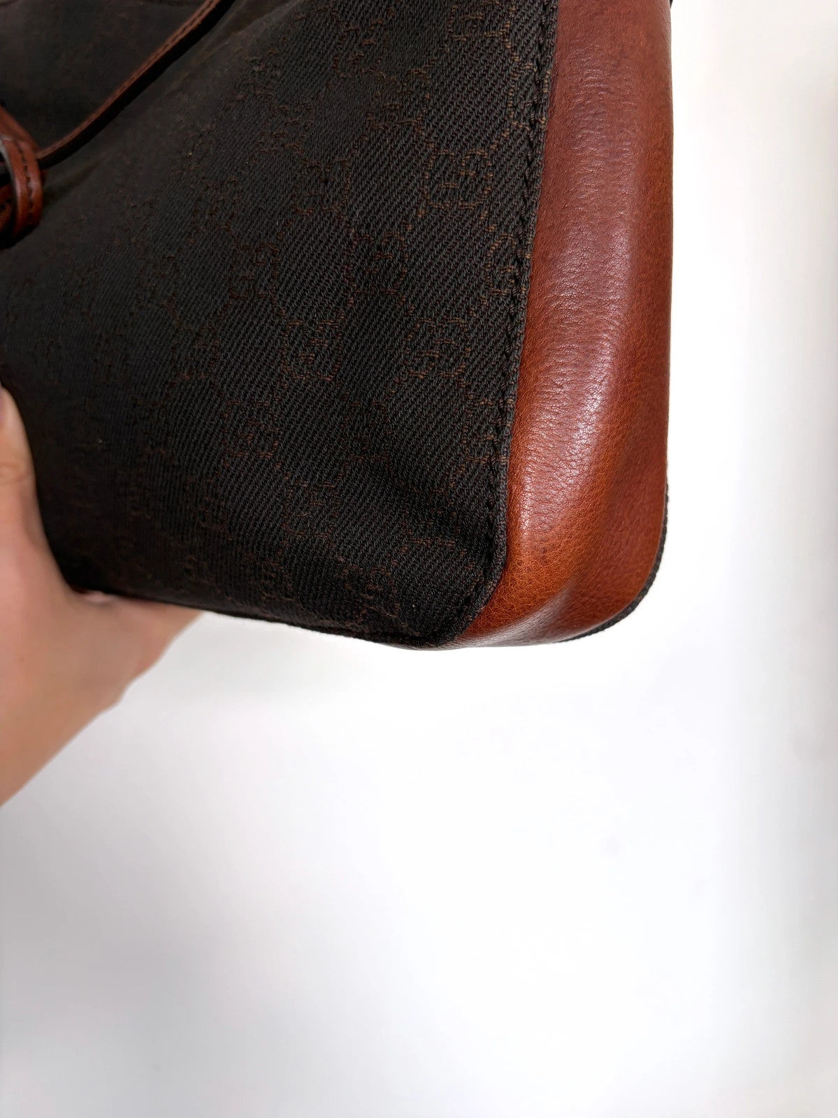 Gucci dark brown hobo bag with GG canvas, Horsebit hardware, and leather trim.