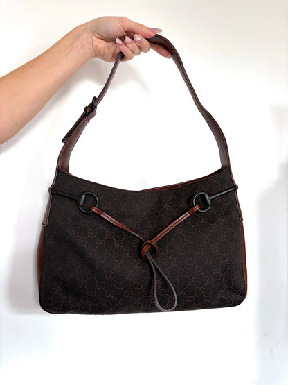 Gucci dark brown hobo bag with GG canvas, Horsebit hardware, and leather trim.