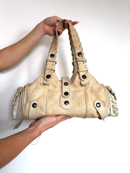 Chloé cream leather Silverado bag with braided handles and oxidized gunmetal studs.