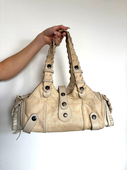 Chloé cream leather Silverado bag with braided handles and oxidized gunmetal studs.