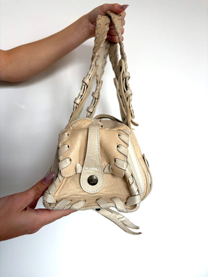 Chloé cream leather Silverado bag with braided handles and oxidized gunmetal studs.