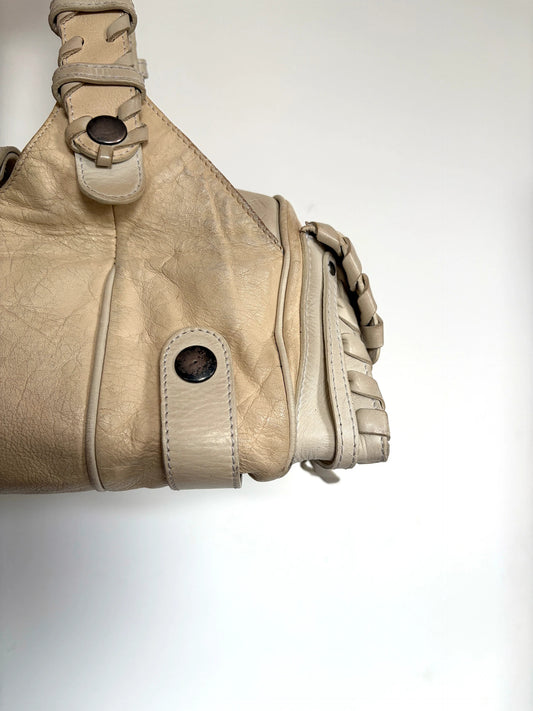 Chloé cream leather Silverado bag with braided handles and oxidized gunmetal studs.