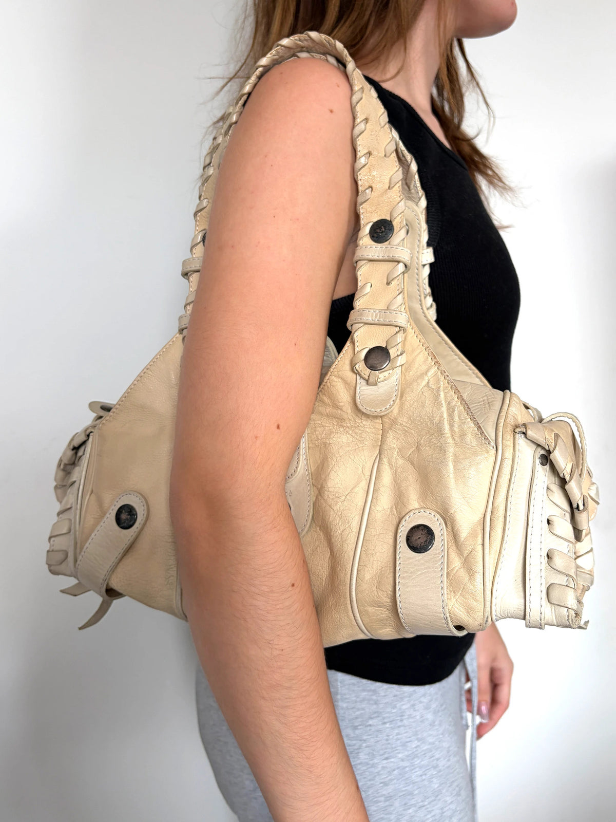 Chloé cream leather Silverado bag with braided handles and oxidized gunmetal studs.