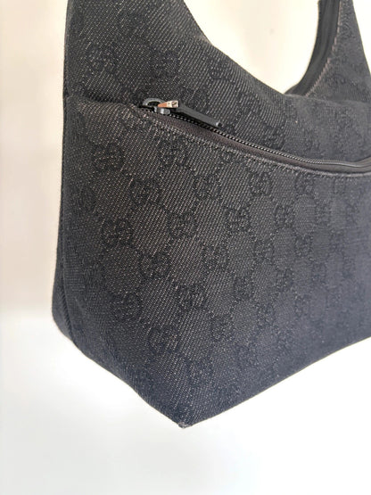 Gucci black hobo shoulder bag with GG monogram denim jacquard and leather piping.