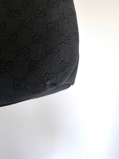 Gucci black hobo shoulder bag with GG monogram denim jacquard and leather piping.