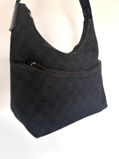 Gucci black hobo shoulder bag with GG monogram denim jacquard and leather piping.