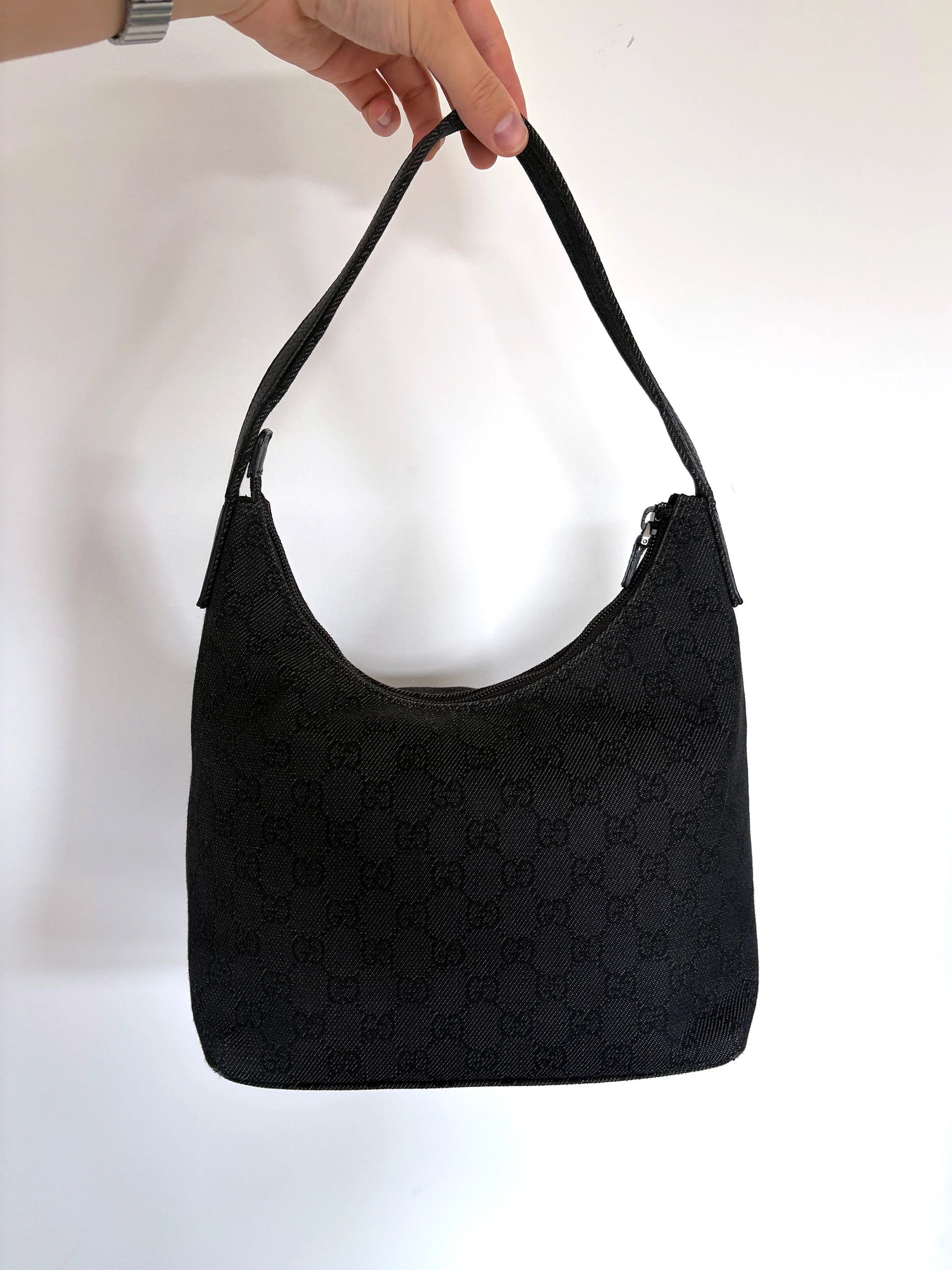 Gucci black hobo shoulder bag with GG monogram denim jacquard and leather piping.
