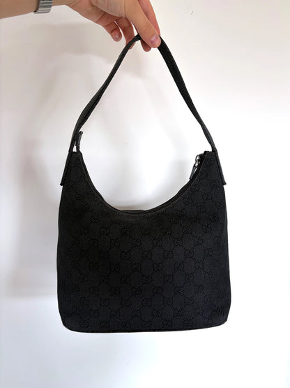 Gucci black hobo shoulder bag with GG monogram denim jacquard and leather piping.