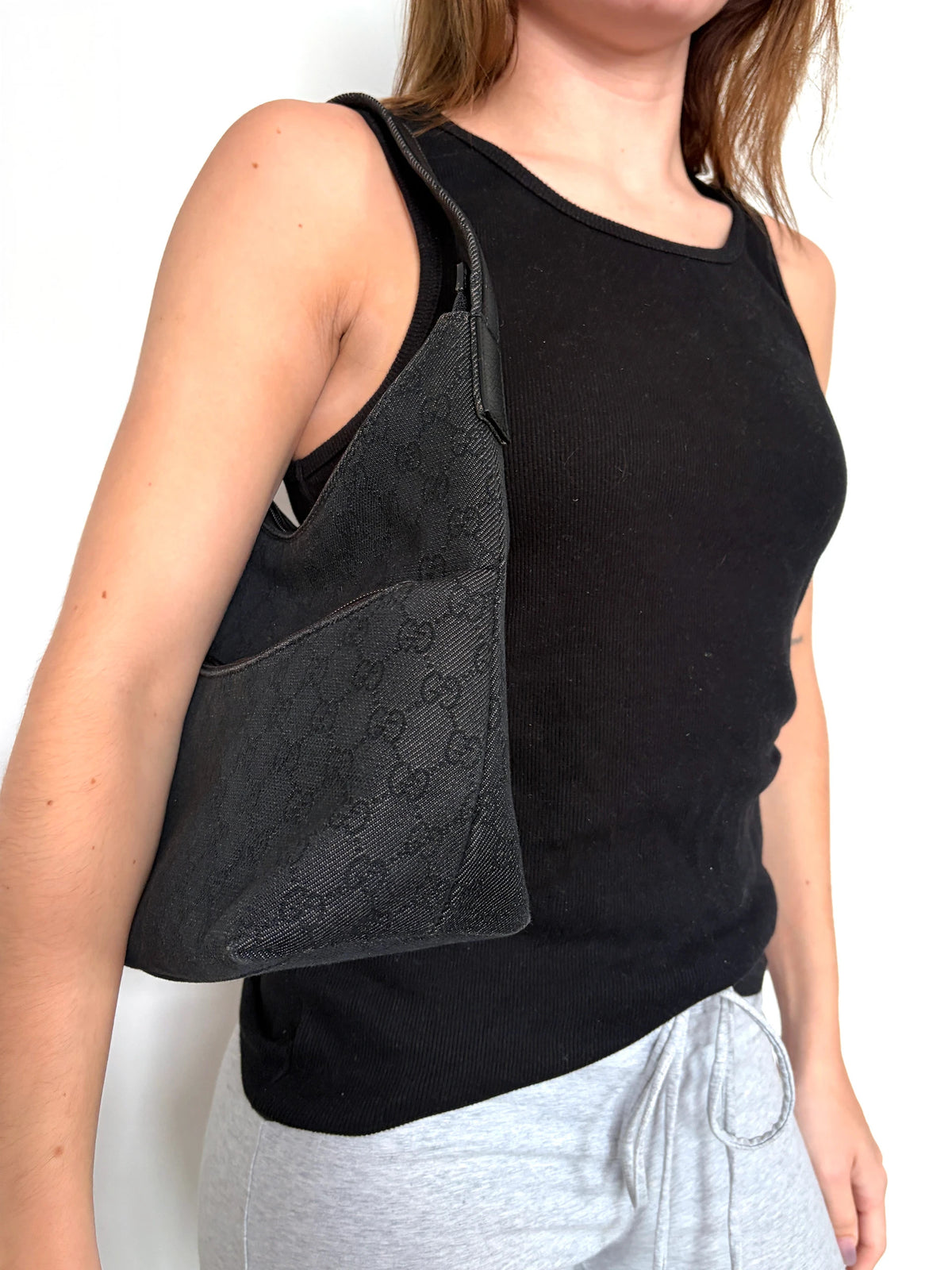 Gucci black hobo shoulder bag with GG monogram denim jacquard and leather piping.
