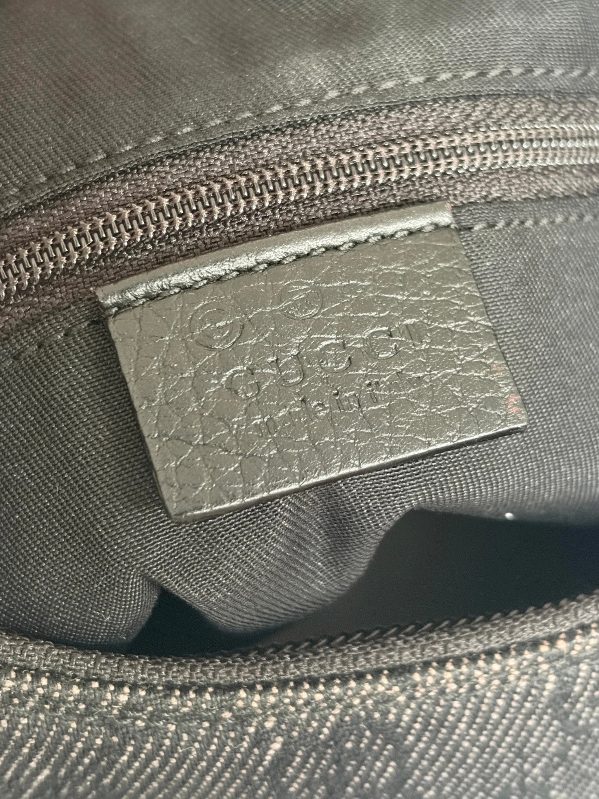 Gucci black hobo shoulder bag with GG monogram denim jacquard and leather piping.