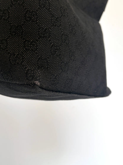 Gucci black hobo shoulder bag with GG monogram denim jacquard and leather piping.