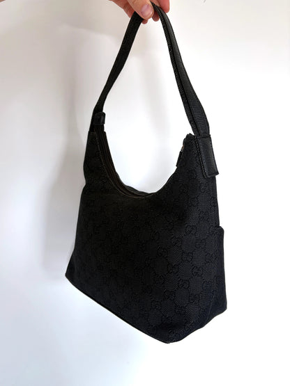 Gucci black hobo shoulder bag with GG monogram denim jacquard and leather piping.