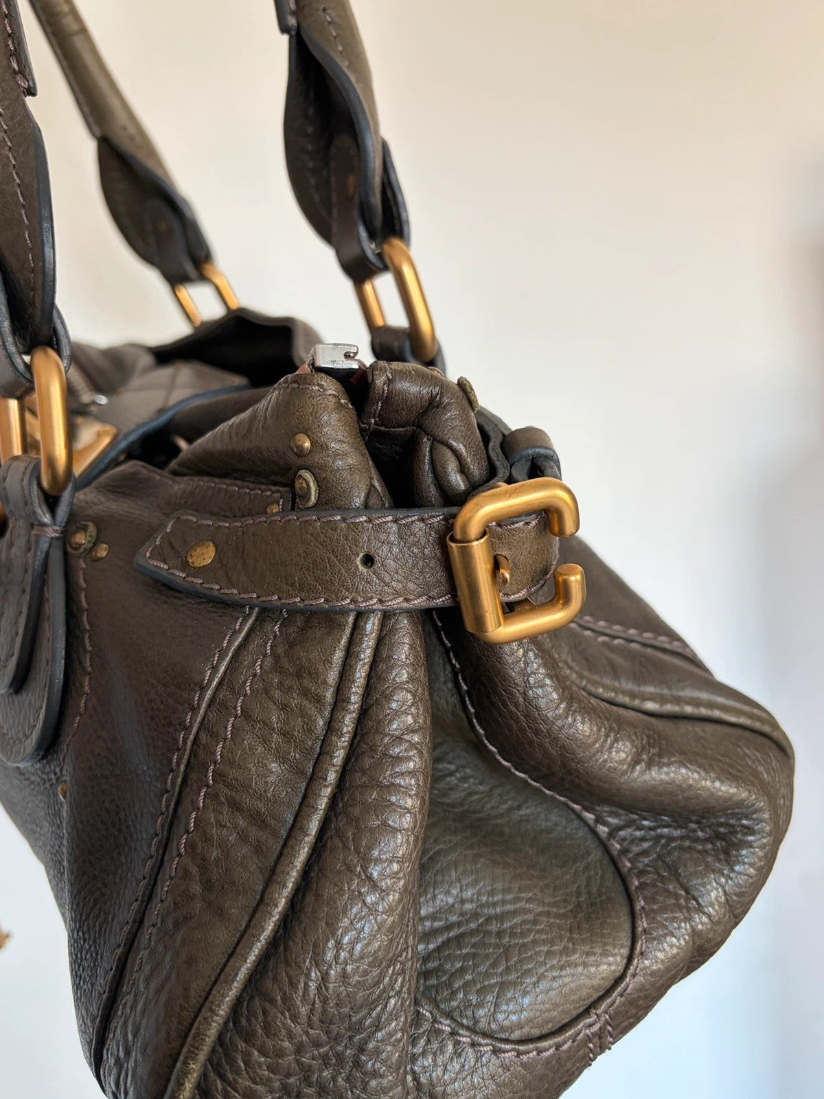 Chloé green leather Paddington bag with brass hardware and engraved padlock detail.