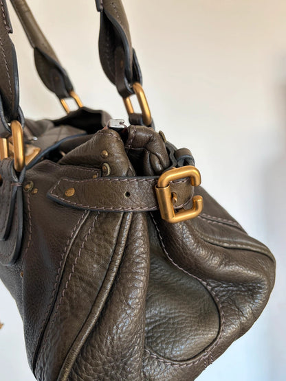 Chloé green leather Paddington bag with brass hardware and engraved padlock detail.