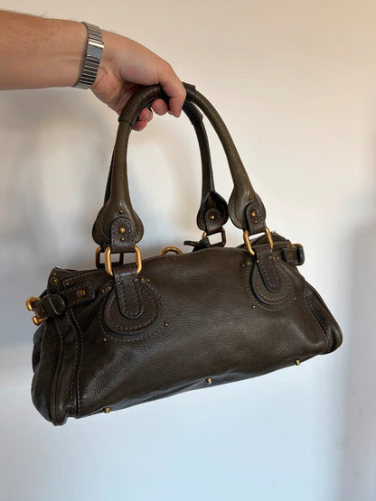 Chloé green leather Paddington bag with brass hardware and engraved padlock detail.