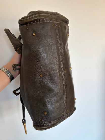 Chloé green leather Paddington bag with brass hardware and engraved padlock detail.