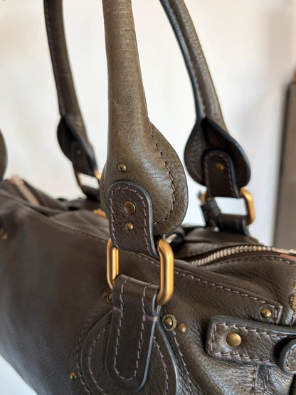 Chloé green leather Paddington bag with brass hardware and engraved padlock detail.