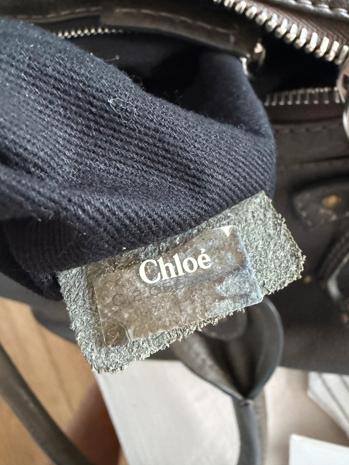 Chloé green leather Paddington bag with brass hardware and engraved padlock detail.