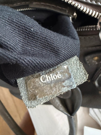 Chloé green leather Paddington bag with brass hardware and engraved padlock detail.