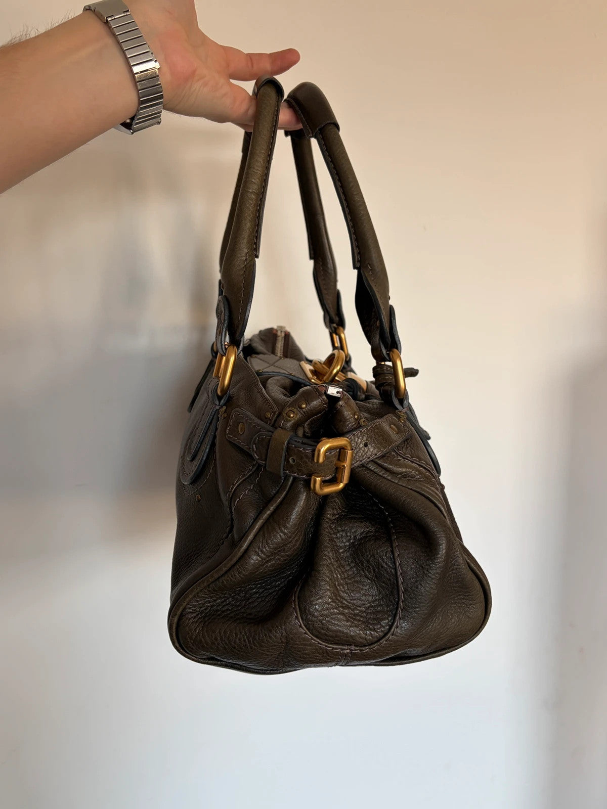 Chloé green leather Paddington bag with brass hardware and engraved padlock detail.