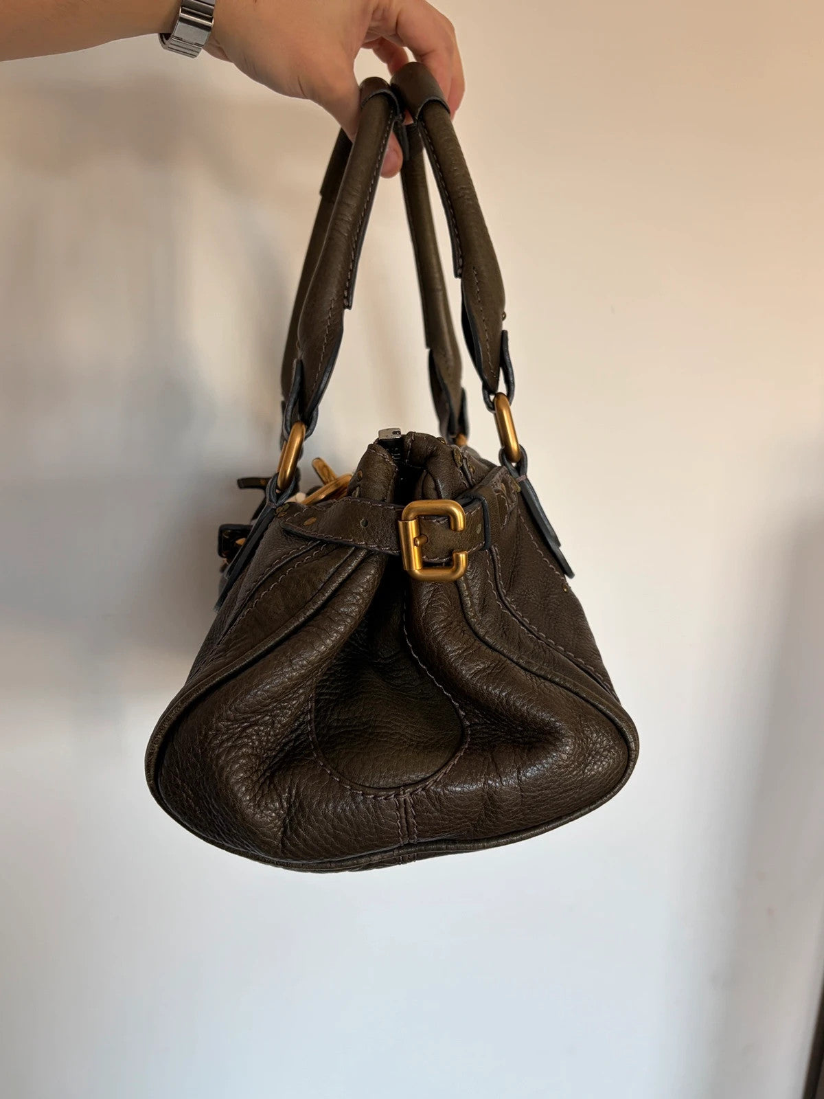 Chloé green leather Paddington bag with brass hardware and engraved padlock detail.