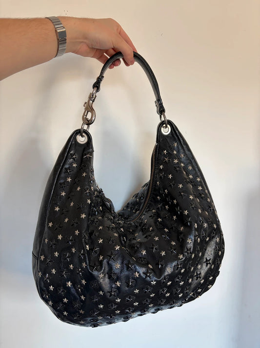 Jimmy Choo black shopping tote with star embellishments and authenticity card.