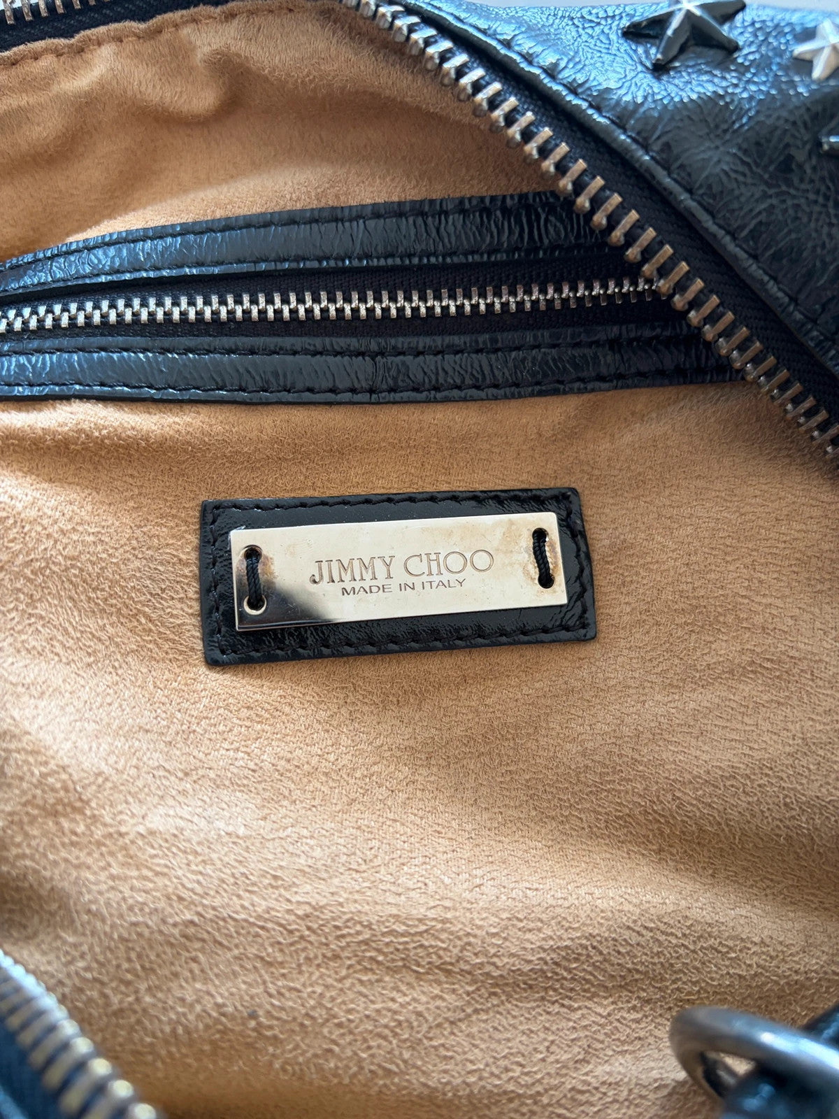 Jimmy Choo black shopping tote with star embellishments and authenticity card.