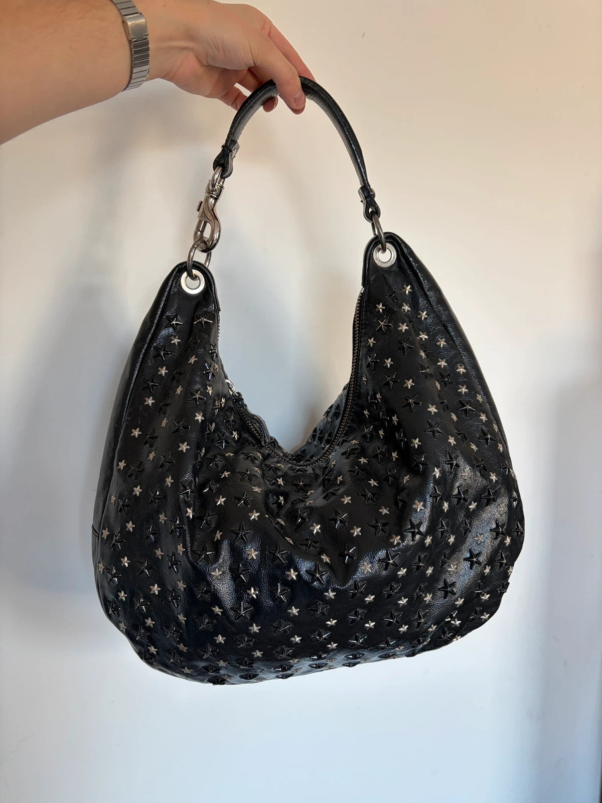 Jimmy Choo black shopping tote with star embellishments and authenticity card.