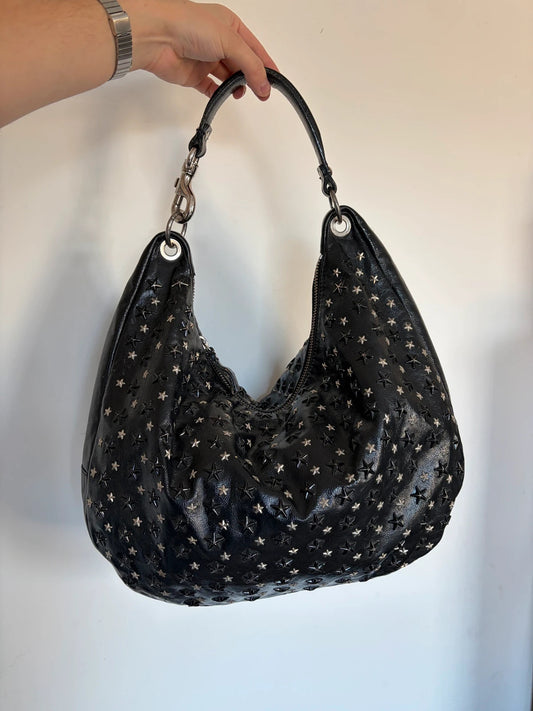 Jimmy Choo black shopping tote with star embellishments and authenticity card.