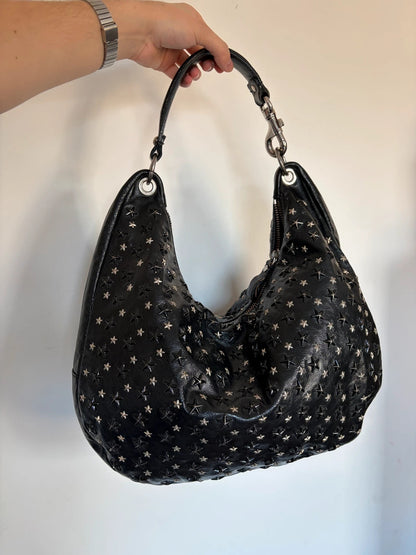Jimmy Choo black shopping tote with star embellishments and authenticity card.
