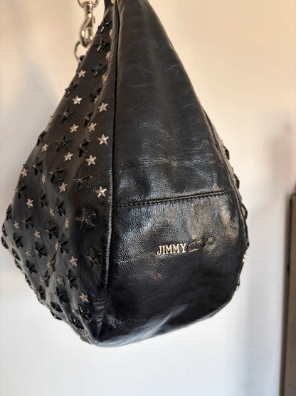 Jimmy Choo black shopping tote with star embellishments and authenticity card.
