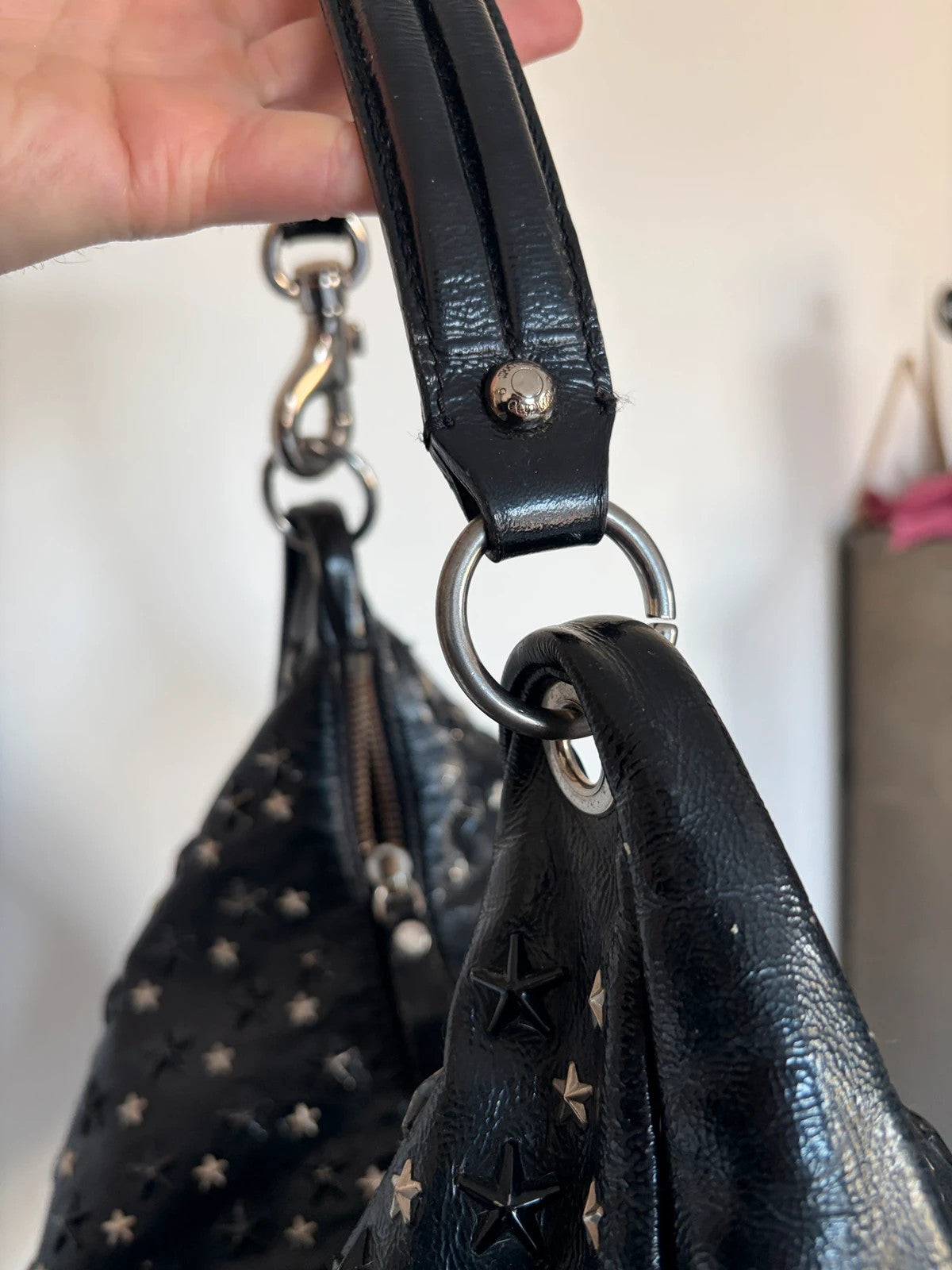 Jimmy Choo black shopping tote with star embellishments and authenticity card.