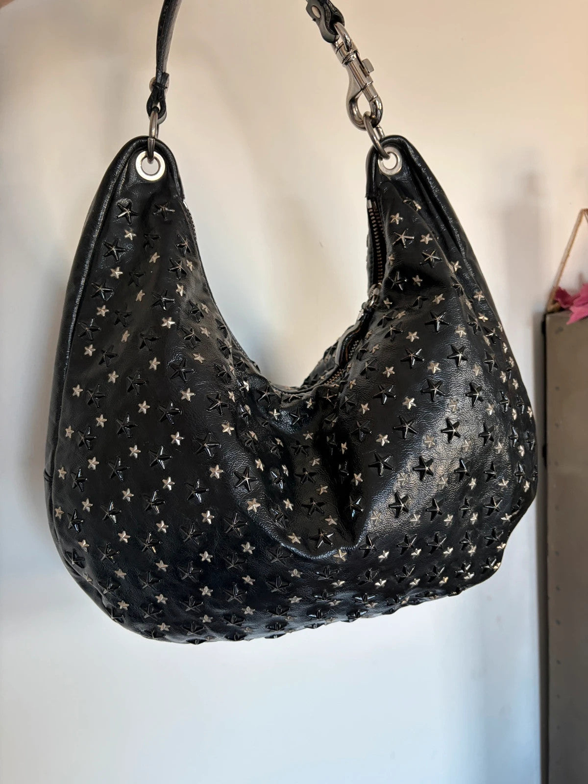 Jimmy Choo black shopping tote with star embellishments and authenticity card.