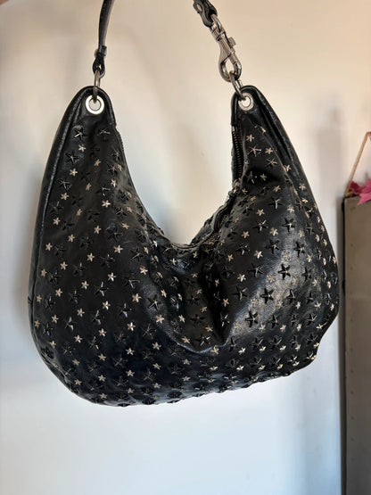 Jimmy Choo black shopping tote with star embellishments and authenticity card.
