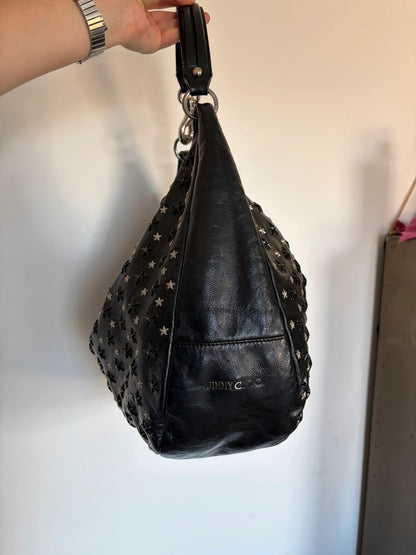 Jimmy Choo black shopping tote with star embellishments and authenticity card.