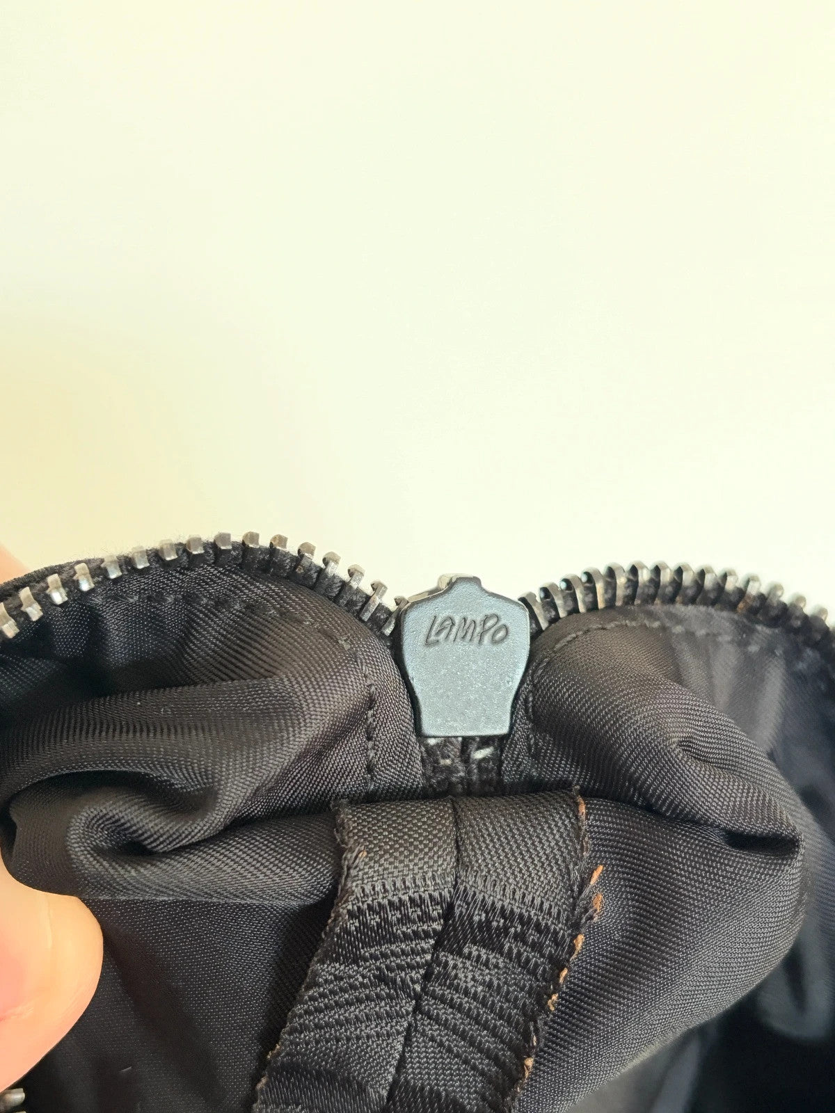 Chanel black shopping tote with woven CC jacquard pattern and smooth calfskin handles.