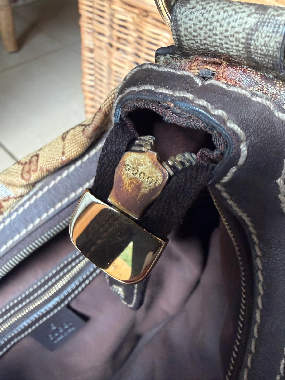 Gucci beige hobo bag with GG Crystal canvas, ruched design, and gold-tone hardware.