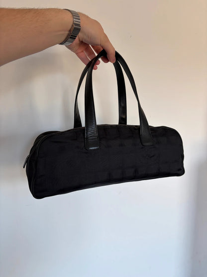 Chanel black handbag woven nylon jacquard with repeating CC monogram and leather trim.