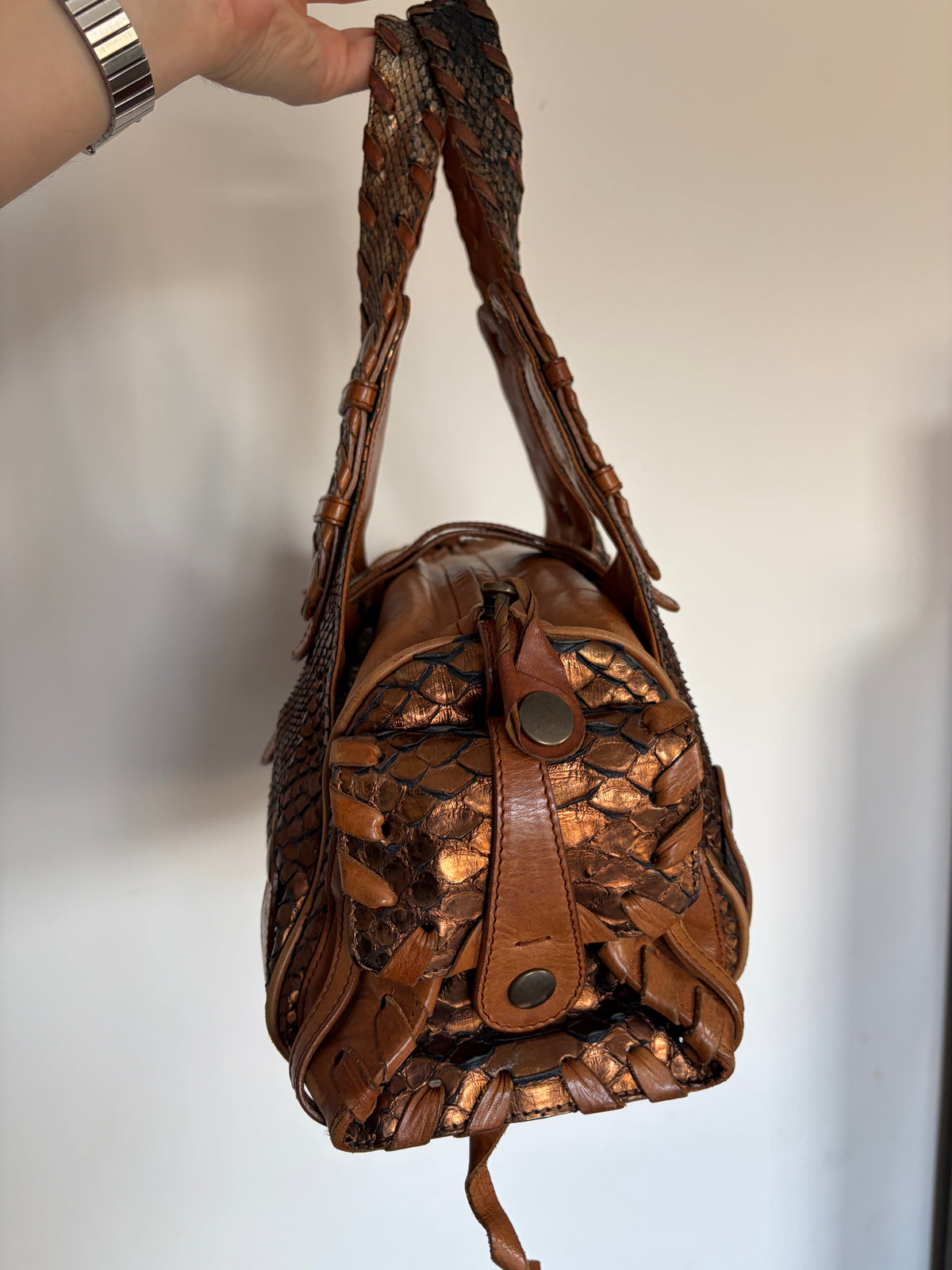 Chloé Silverado bag in metallic bronze python with whipstitched handles and studs