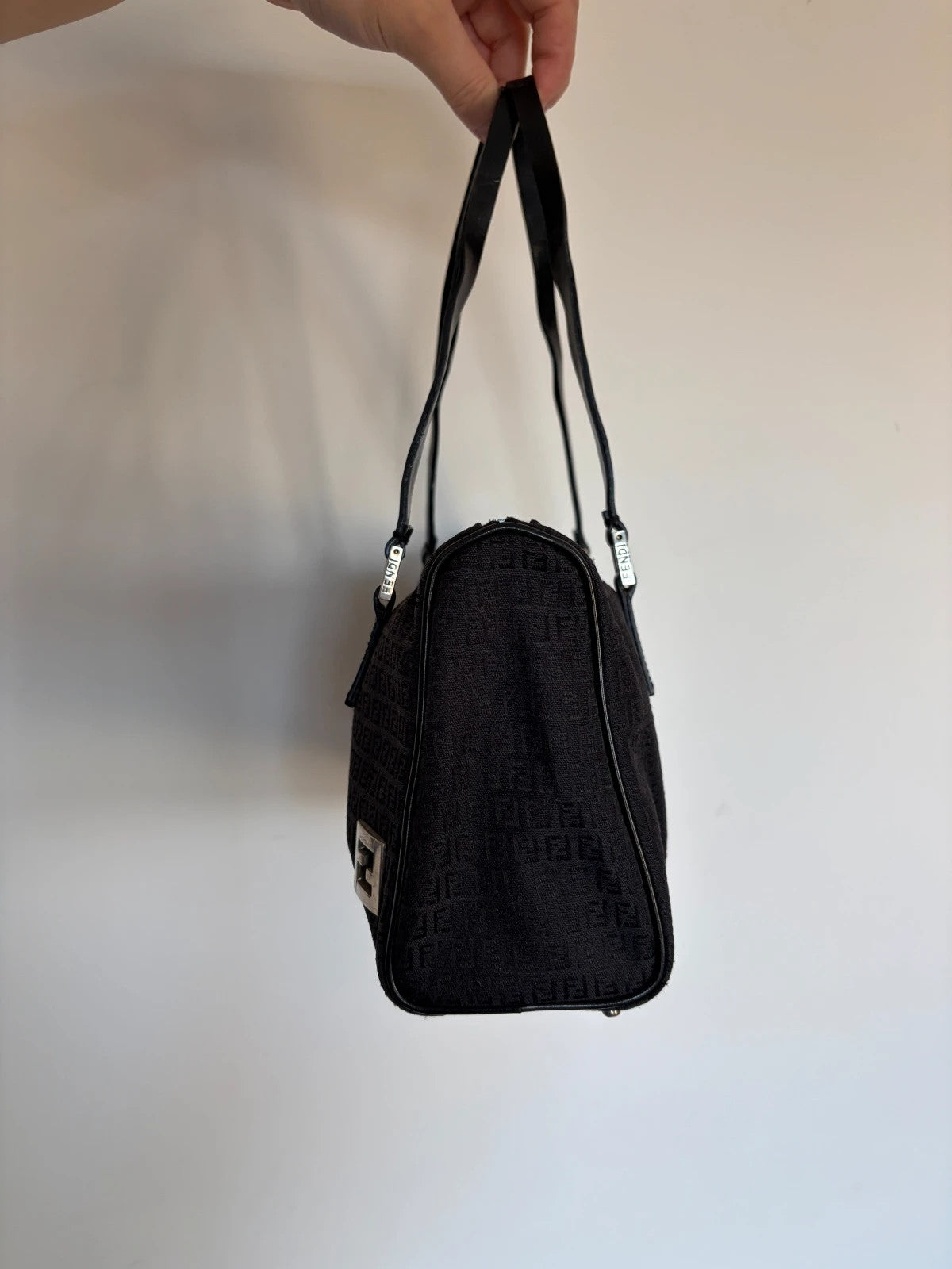 Fendi black shoulder bag with Zucchino monogram canvas, silver-tone hardware, and leather trim.