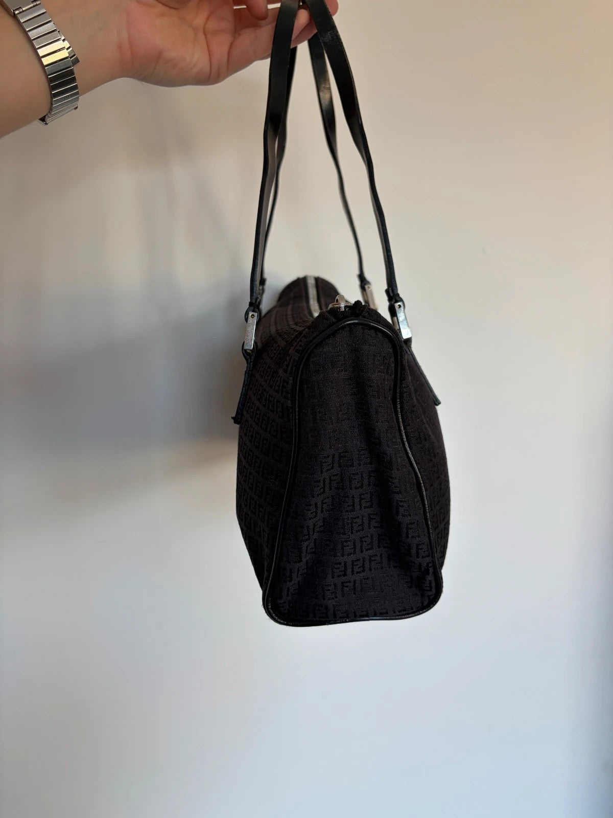 Fendi black shoulder bag with Zucchino monogram canvas, silver-tone hardware, and leather trim.